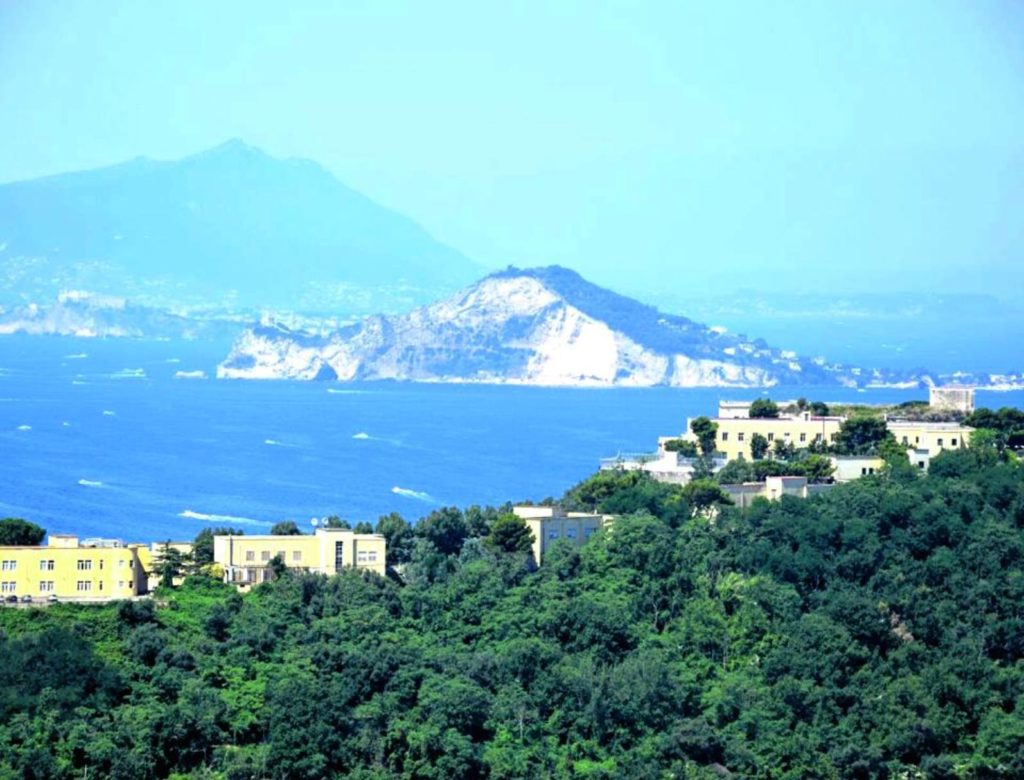 naples photography spots showing the high terraced gardens of parco virgiliano overlooking the steep cliffs and islands