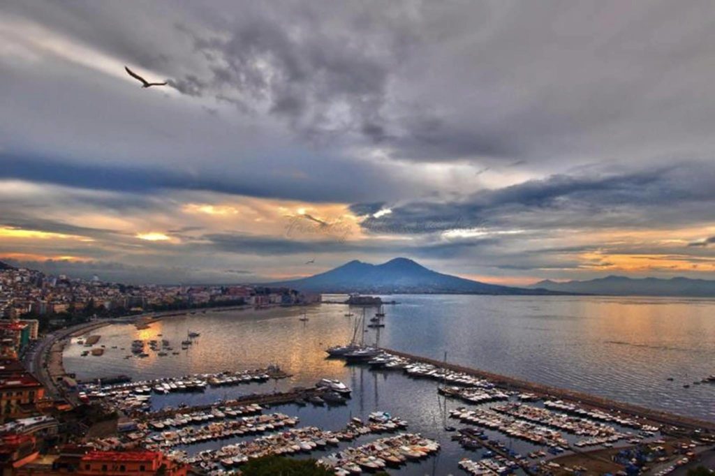 capri day trip from naples panoramic view of the blue sea and distant island from posillipo