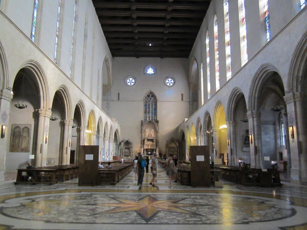 naples photography spots colorful majolica tiled columns inside santa chiara cloister