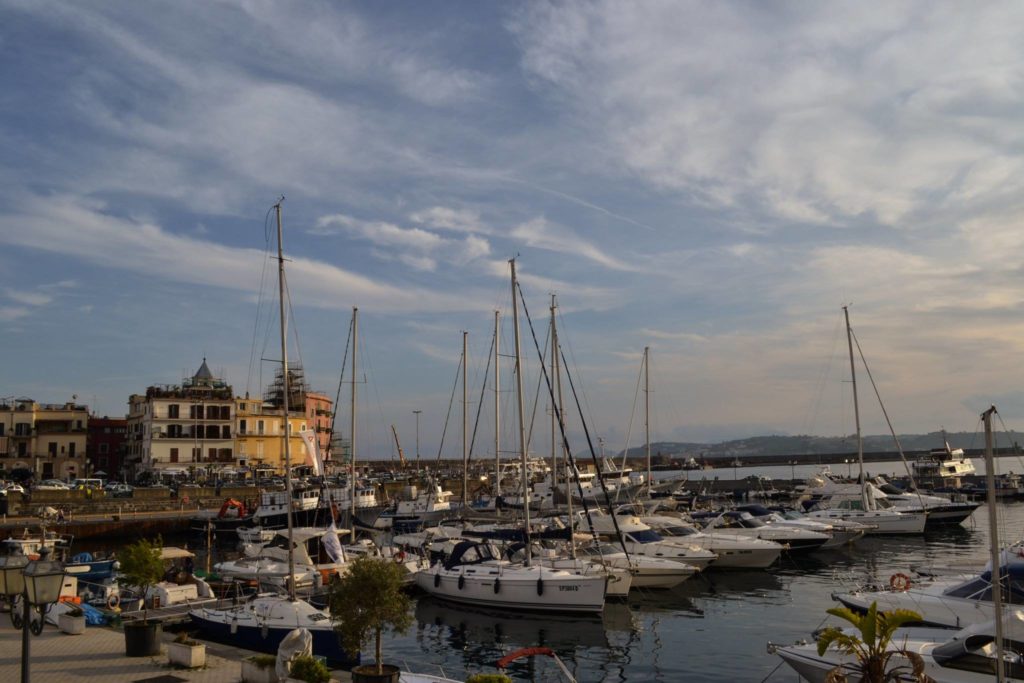 naples hidden gems darsena pozzuoli italy inner harbour landing ancient quay fishing boats morning