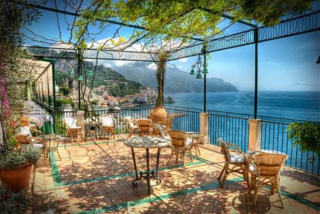 costiera amalfitana amalfi photo spots highlighting the sweeping coastal harbor curves with cliffs rising cleanly across the bay