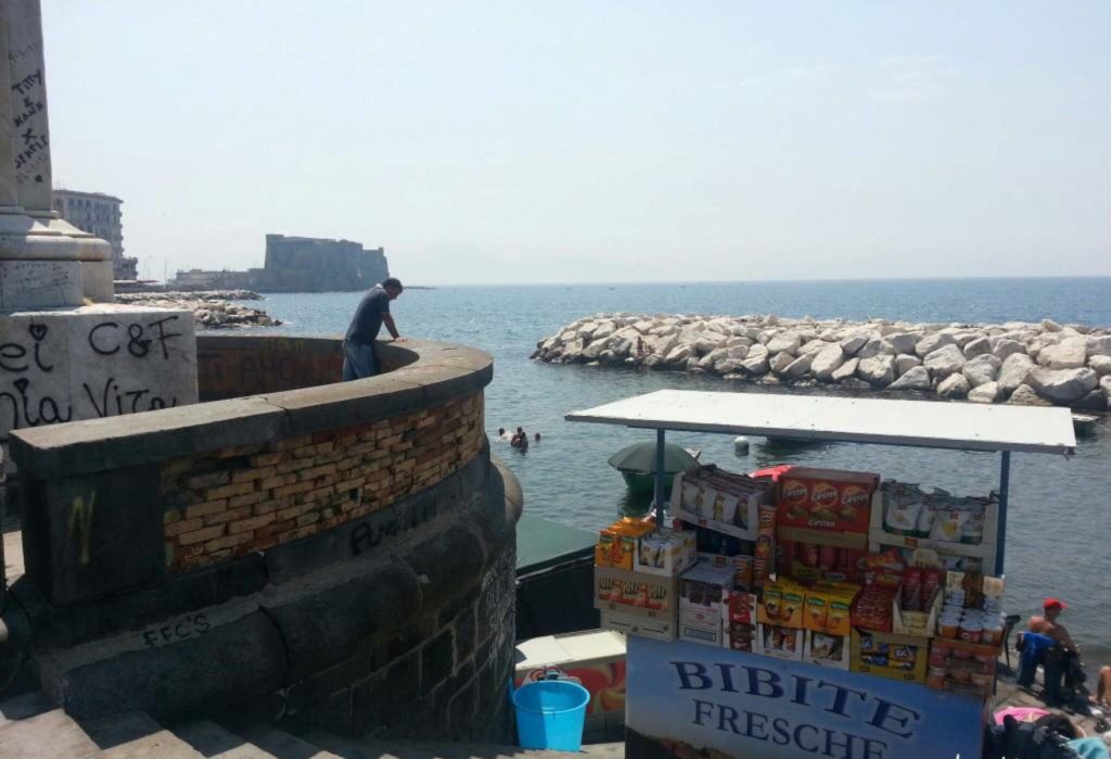 colonna spezzata lungomare liberato naples photo spots showing the beautiful paved coastal walkway looking cleanly across the turquoise bay water
