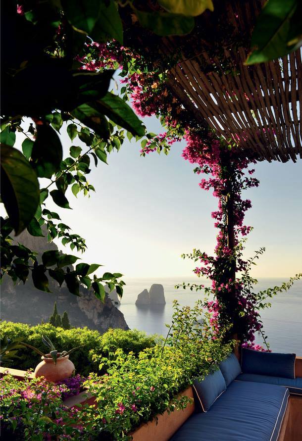 sea faraglioni capri photo spots showing the dramatic limestone rocks towering directly out of the deep turquoise sea cleanly