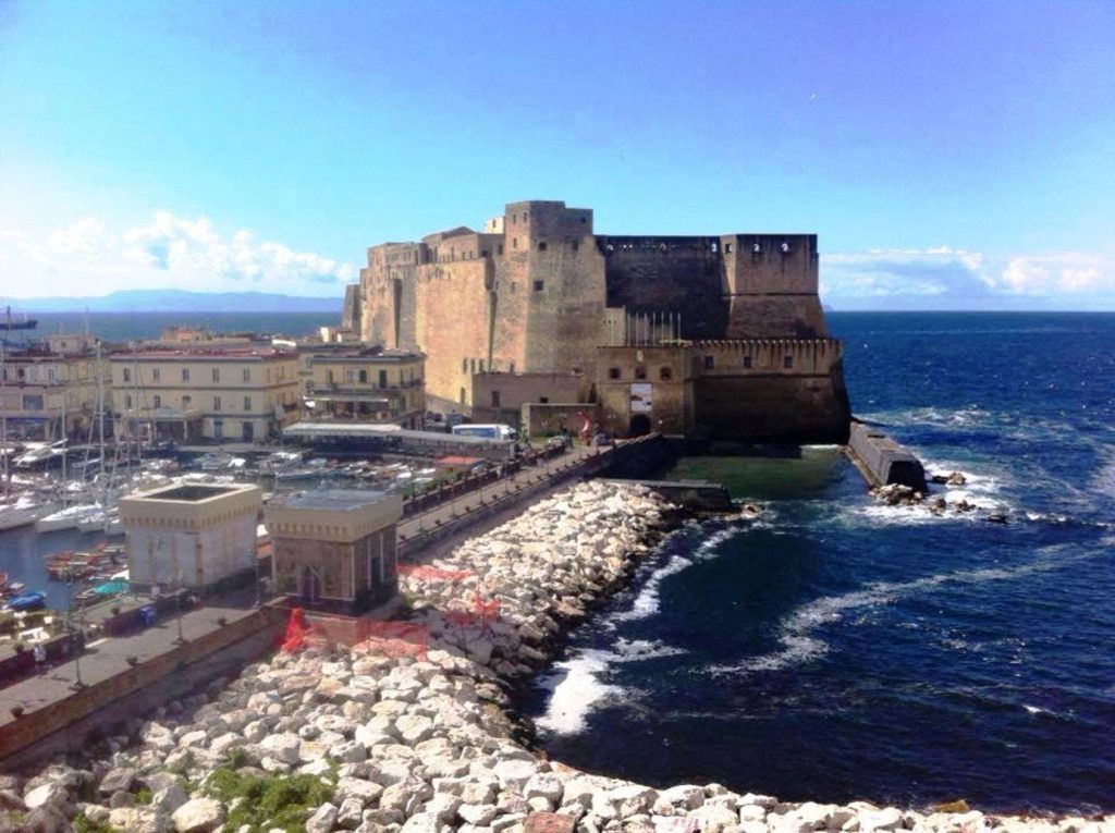 castel dell'ovo napoli photo spots featuring the ancient tufa stone walls of the castle rising directly from the sea cleanly