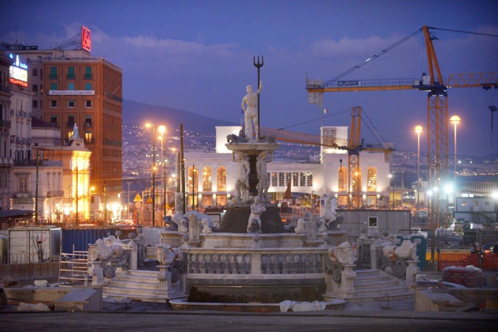 best photo spots in piazza municipio napoli showing the expansive stone public square and grand historic city hall architecture cleanly